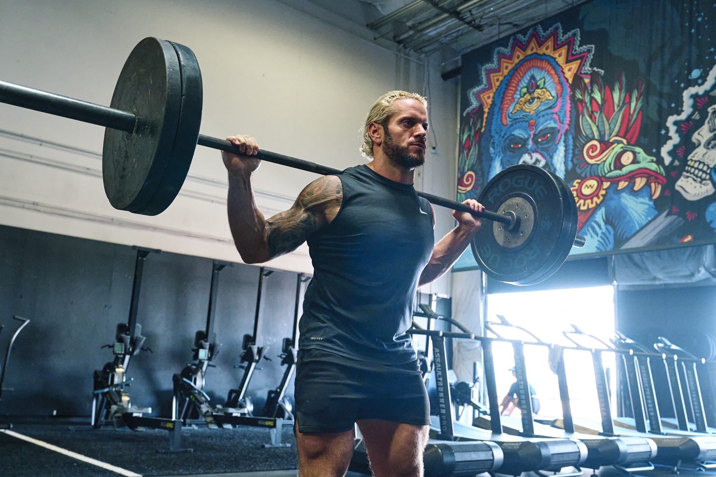 Jarred Curcio under a loaded barbell